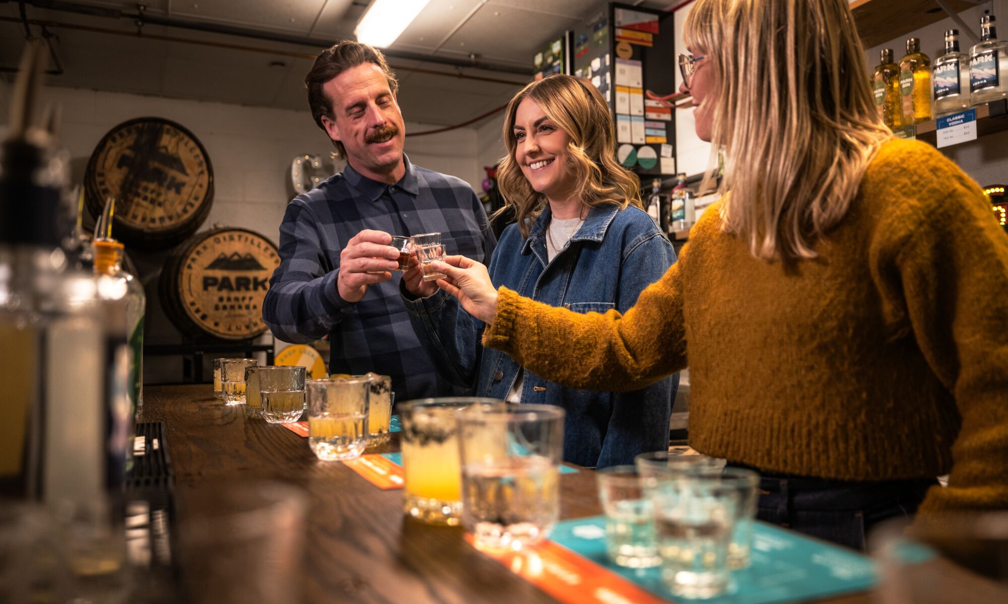 Three people trying gin during the Blend your Own Gin experience at PARK Distillery.